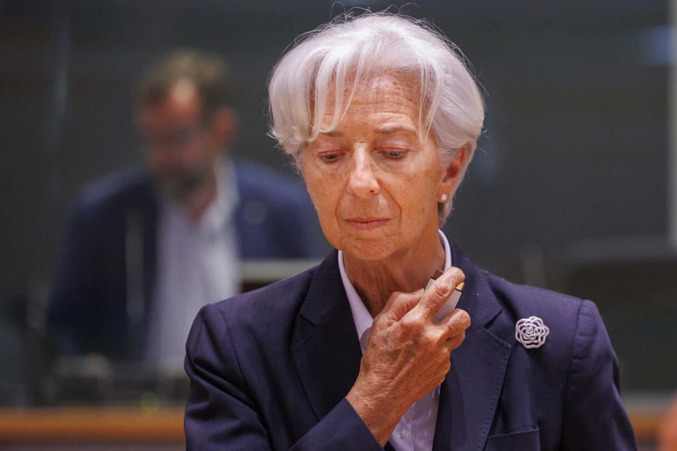 European Central Bank President Christine Lagarde enjoys a spray of perfume prior to a meeting of Eurogroup Finance Ministers at the European Council building in Brussels, Monday, May 23, 2022. (AP Photo/Olivier Matthys)