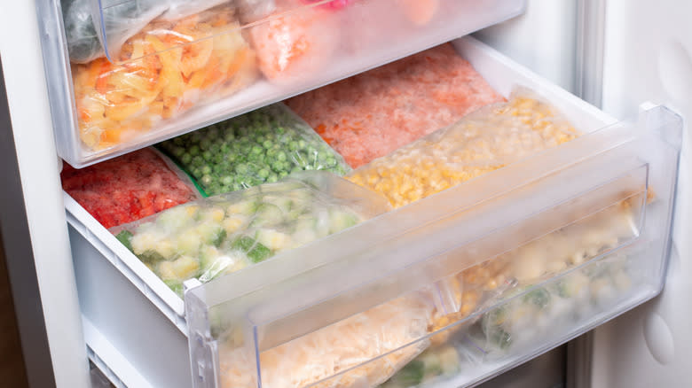 Bags of frozen food in a freezer