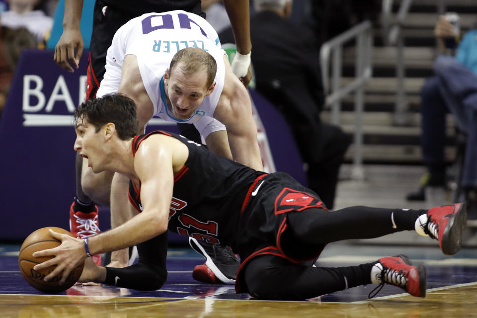 Chicago Bulls' Ryan Arcidiacono (51) controls the ball as he looks to pass to an open teammate after stealing the ball from Charlotte Hornets' Cody Zeller (40) during the second half of an NBA basketball game in Charlotte, N.C., Saturday, Nov. 23, 2019. (AP Photo/Bob Leverone)