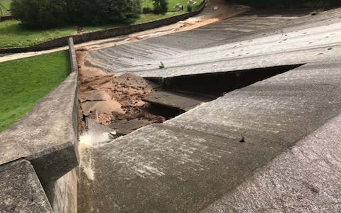 The damage to the dam wall - Credit: Fraglast/PA