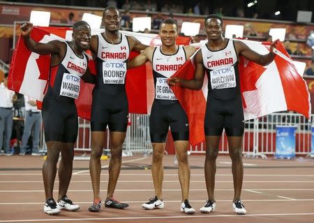 Canada's Justyn Warner, Brendon Rodney, Andre de Grasse and Aaron Brown (L-R) celebrate after finishing third in the 4 x 100 metres relay final during the 15th IAAF World Championships at the National Stadium in Beijing, China August 29, 2015. REUTERS/Phil Noble