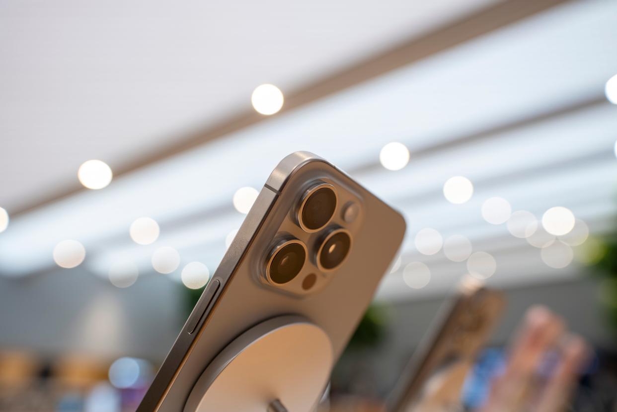 The iPhone 15 Pro Max in natural titanium seen from below with it's distinct 3 camera profile on display in store on September 22, 2023 in Milan, Italy