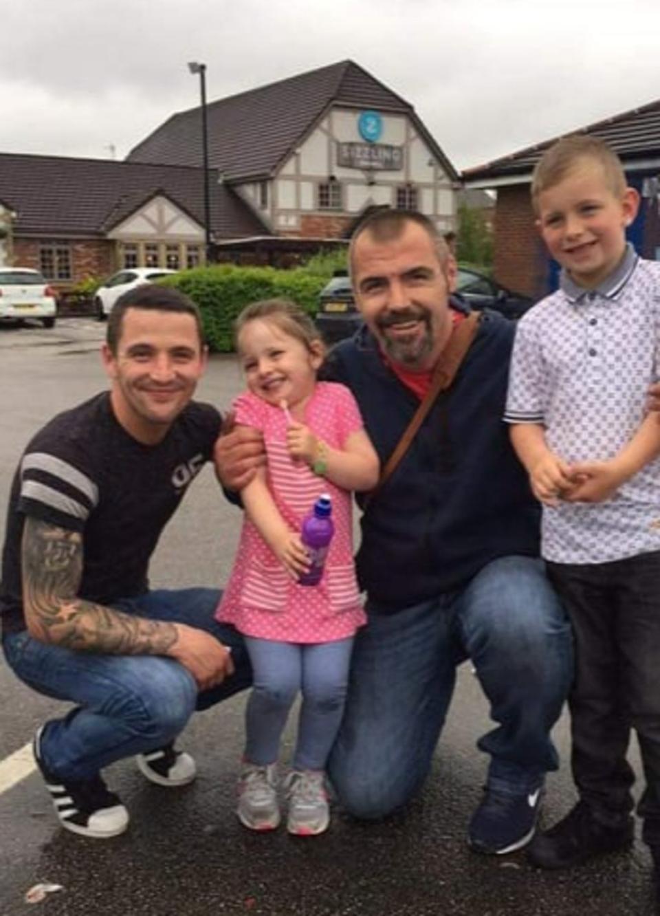 Stuart McDonald (third from left) with his son Robert (L) and two grandchildren (Supplied)