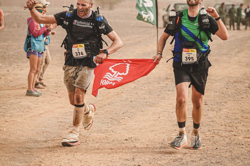 Lee and Andrew carried a Nottingham Forest flag all the way around and waved it as they crossed the final finish line