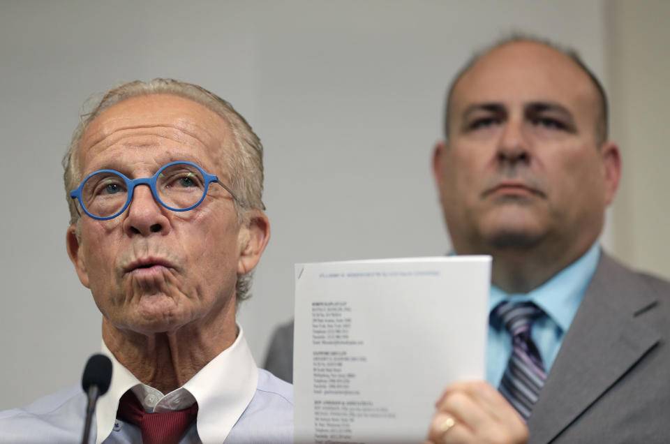 While Richard Halvorson, right, listens, attorney Jeff Anderson speaks during a news conference in Newark, N.J., Tuesday, April 30, 2019. Halvorson is alleging sexual abuse in a lawsuit filed against the Boy Scouts of America. (AP Photo/Seth Wenig)