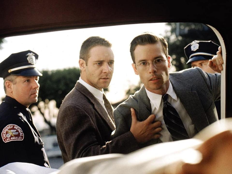 Russell Crowe as Bud White and Guy Pearce as Ed Exley in "L.A. Confidential" (1997).