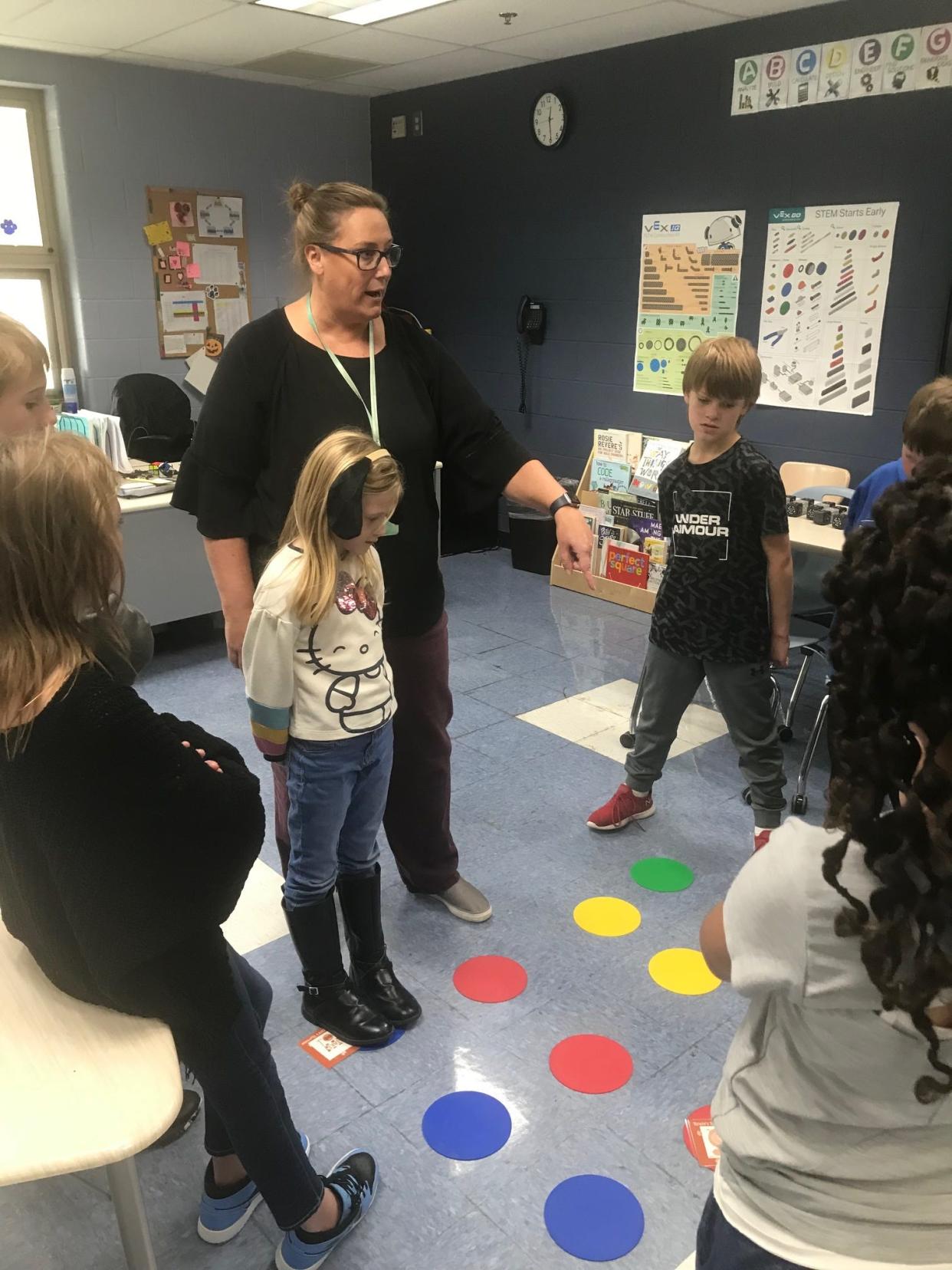 Intermediate School STEM teacher Michelle Johnston teaches students unplugged programing during a recent STEM class.