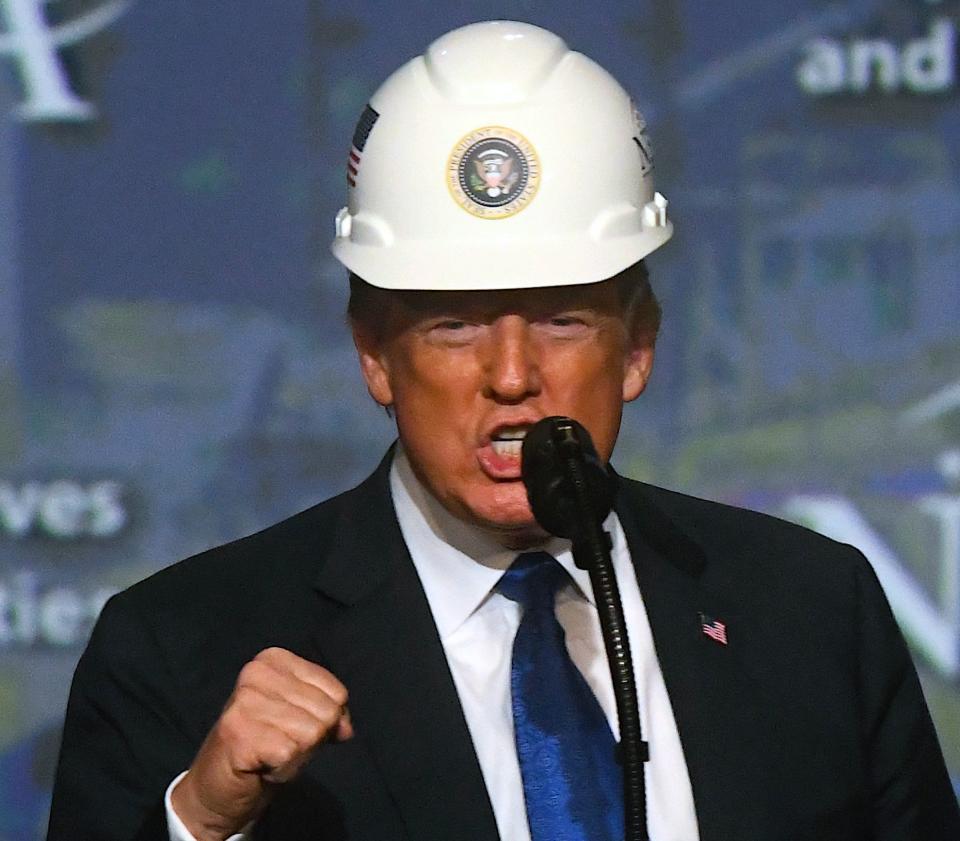 U.S. President Donald Trump wears a hard hat as he addresses the National Electrical Contractors Convention on October 2, 2018 in Philadelphia, Pennsylvania. (Photo: Mark Makela/Getty Images)