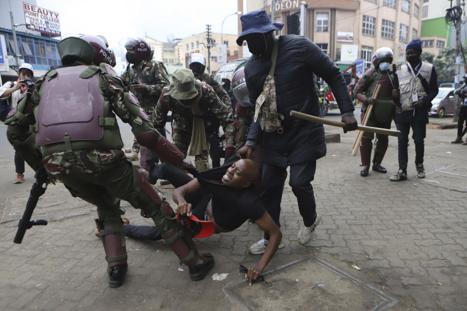 A protester is arrested in Nairobi, Kenya, Thursday Aug. 8, 2024, during a demonstration against hunger. (AP Photo/Andrew Kasuku)