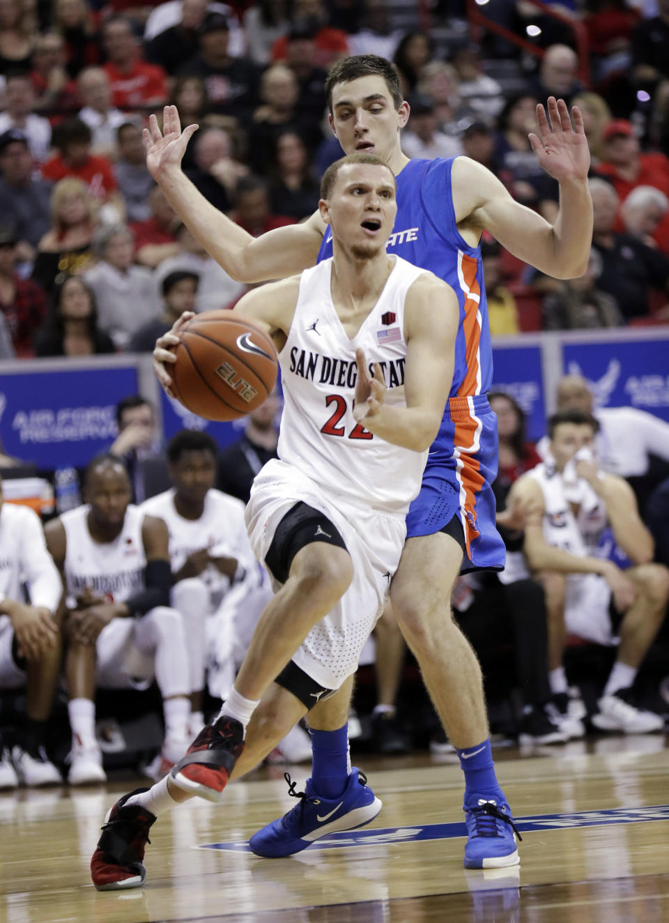 San Diego State's Malachi Flynn (22) drives to the hoop as Boise State's Justinian Jessup defends during the second half of an NCAA college basketball game in the Mountain West Conference men's tournament Friday, March 6, 2020, in Las Vegas. (AP Photo/Isaac Brekken)