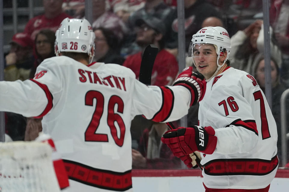 Carolina Hurricanes defenseman Brady Skjei (76) celebrates his goal with Paul Stastny (26) in the first period of an NHL hockey game against the Detroit Red Wings Tuesday, Dec. 13, 2022, in Detroit. (AP Photo/Paul Sancya)