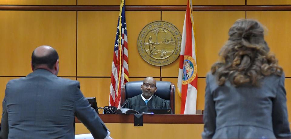 Judge Samuel Bookhardt listens to Jason Wandner, attortney for the defendant, and Prosecutor Julia Lynch. Lakeisha Mitchell, 42, facing multiple charges, including first-degree murder in the death of 4-year-old Joy King Castro, was in a Viera courtroom  for the second part of her bond hearing.