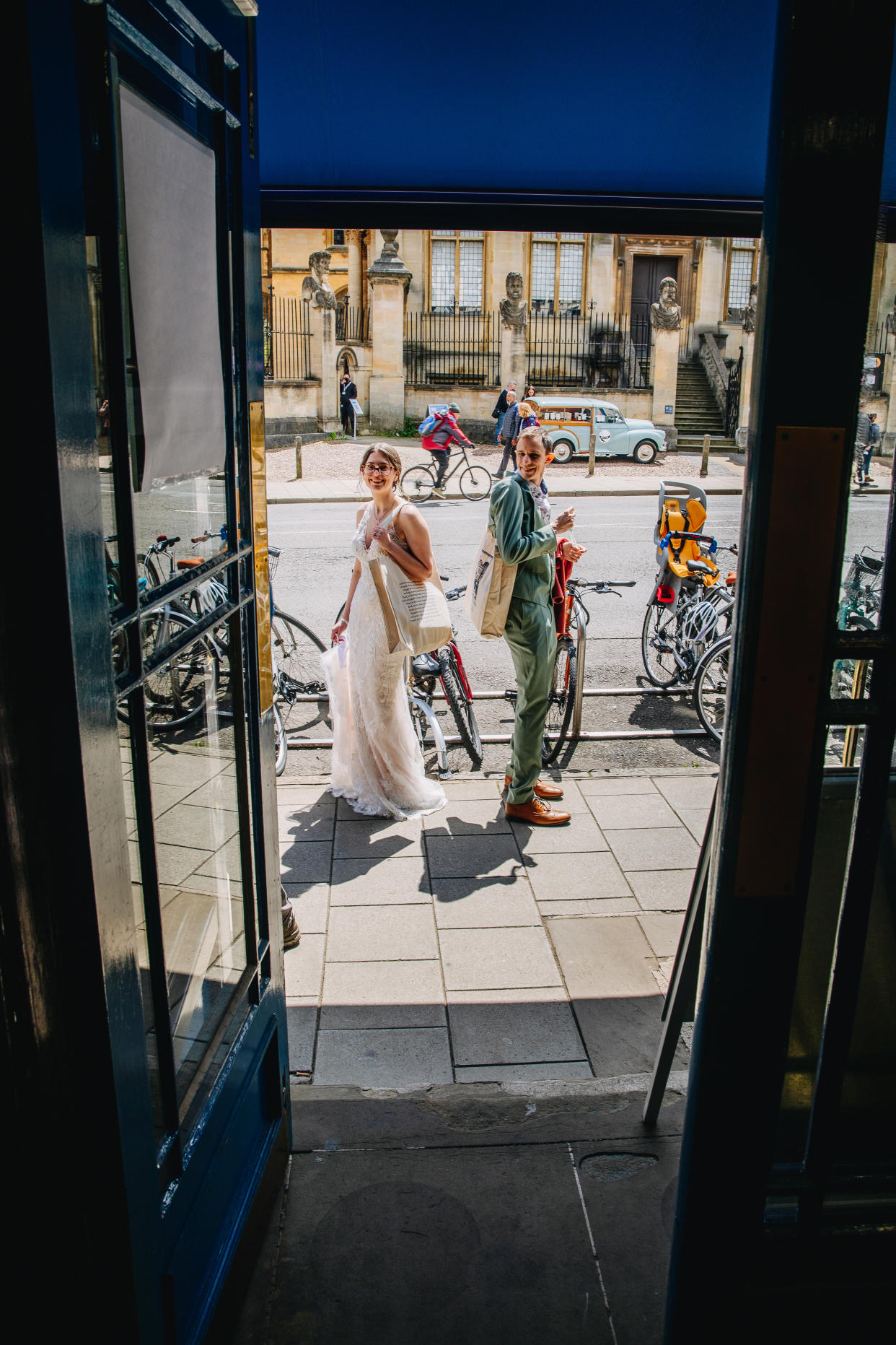 Janine and Joe at the shop on their wedding day (Lucy Judson Photography)