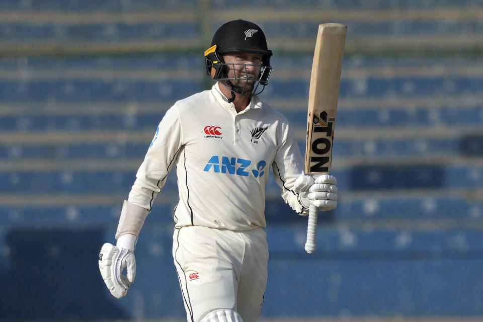 New Zealand's Devon Conway celebrates after scoring fifty during the second day of first test cricket match between Pakistan and New Zealand, in Karachi, Pakistan, Tuesday, Dec. 27, 2022. (AP Photo/Fareed Khan)