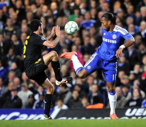 Chelsea's Ivorian striker Didier Drogba (R) vies with Barcelona's Spanish midfielder Sergio Busquets (L) during their UEFA Champions League semi-final first leg football football match at Stamford Bridge in London, England. Chelsea won 1-0