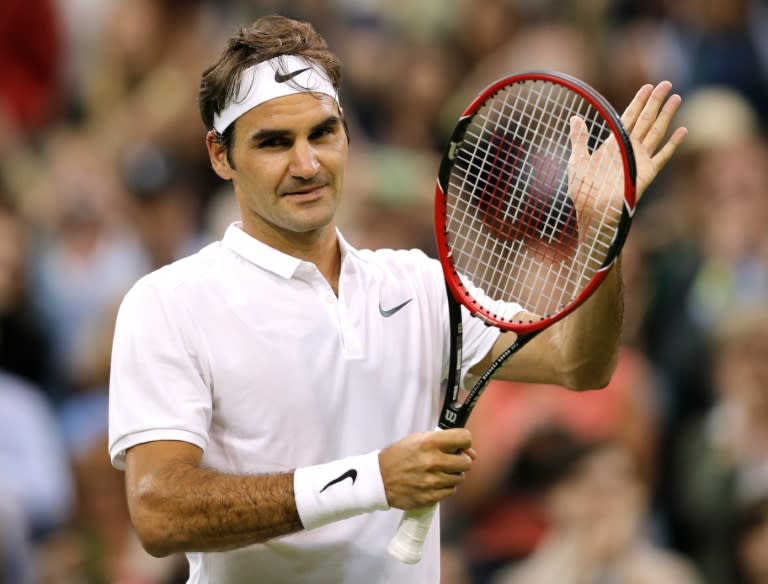 Switzerland's Roger Federer celebrates beating Britain's Daniel Evans during their men's singles third round match at Wimbledon, on July 1, 2016