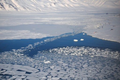 File photo shows ice melting next to the village of Ny-Aalesund in the Arctic. The sea ice in the Arctic Ocean has melted to its smallest point ever in a milestone that may show that worst-case forecasts on climate change are coming true, US scientists said