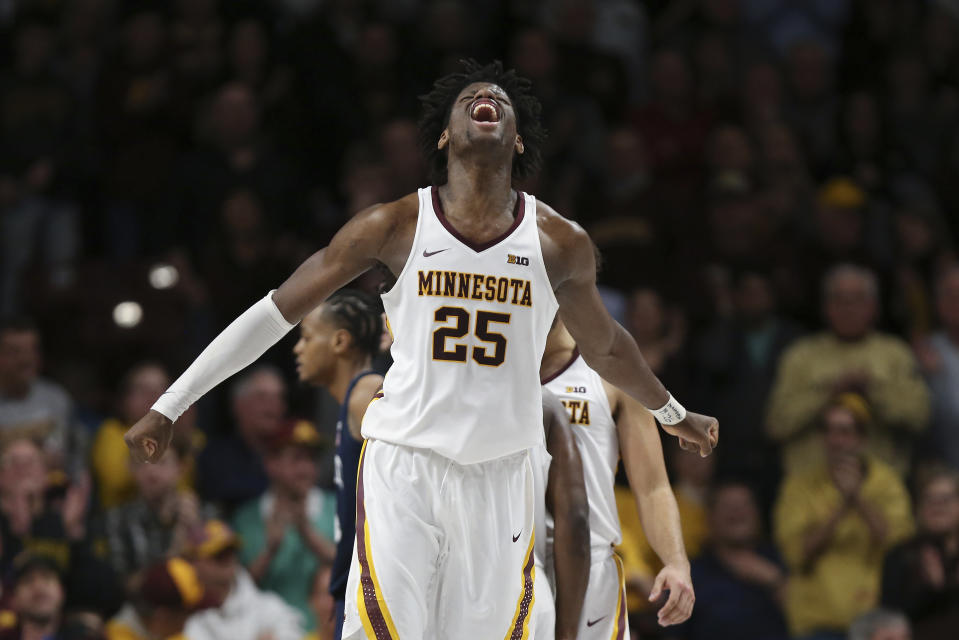 Minnesota's Daniel Oturu reacts to his team scoring a basket in the second half of an NCAA college basketball game against Penn State, Wednesday, Jan. 15, 2020, in Minneapolis. Minnesota won 75-69. (AP Photo/Stacy Bengs)