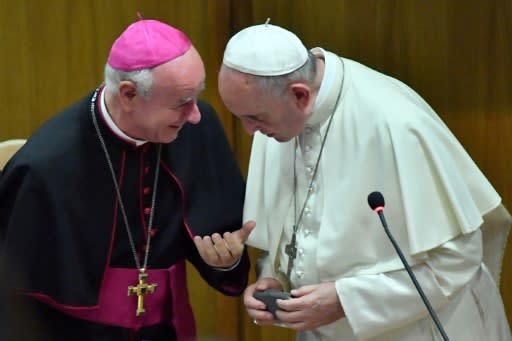 Archbishop Vincenzo Paglia, seen here with Pope Francis last year, said he 'received threats' for championing the canonisation of Oscar Romero