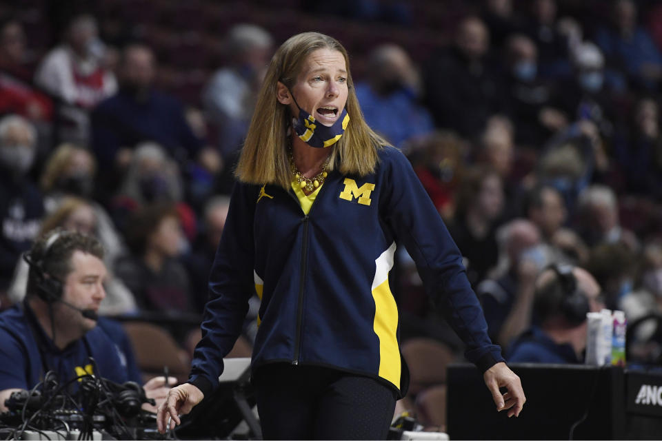 Michigan head coach Kim Barnes Arico calls out to her team in the second half of an NCAA college basketball game against Baylor, Sunday, Dec. 19, 2021, in Uncasville, Conn. (AP Photo/Jessica Hill)