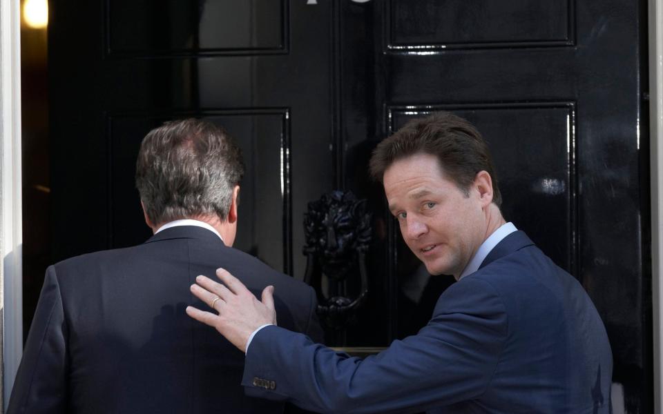 Nick Clegg and David Cameron enter 10 Downing Street together in 2010