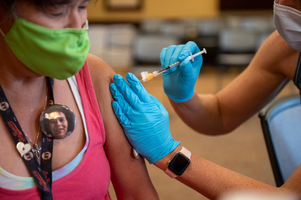 Fort Collins resident Esther Worman receives her first dose of the Pfizer vaccine, Wednesday, Aug. 25, 2021, at the Longs Peak Student Center at Front Range Community College in Fort Collins. Coloradoan file photo