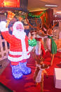 Santa with his reindeer at the entrance of Christmas Village in the Tropics.