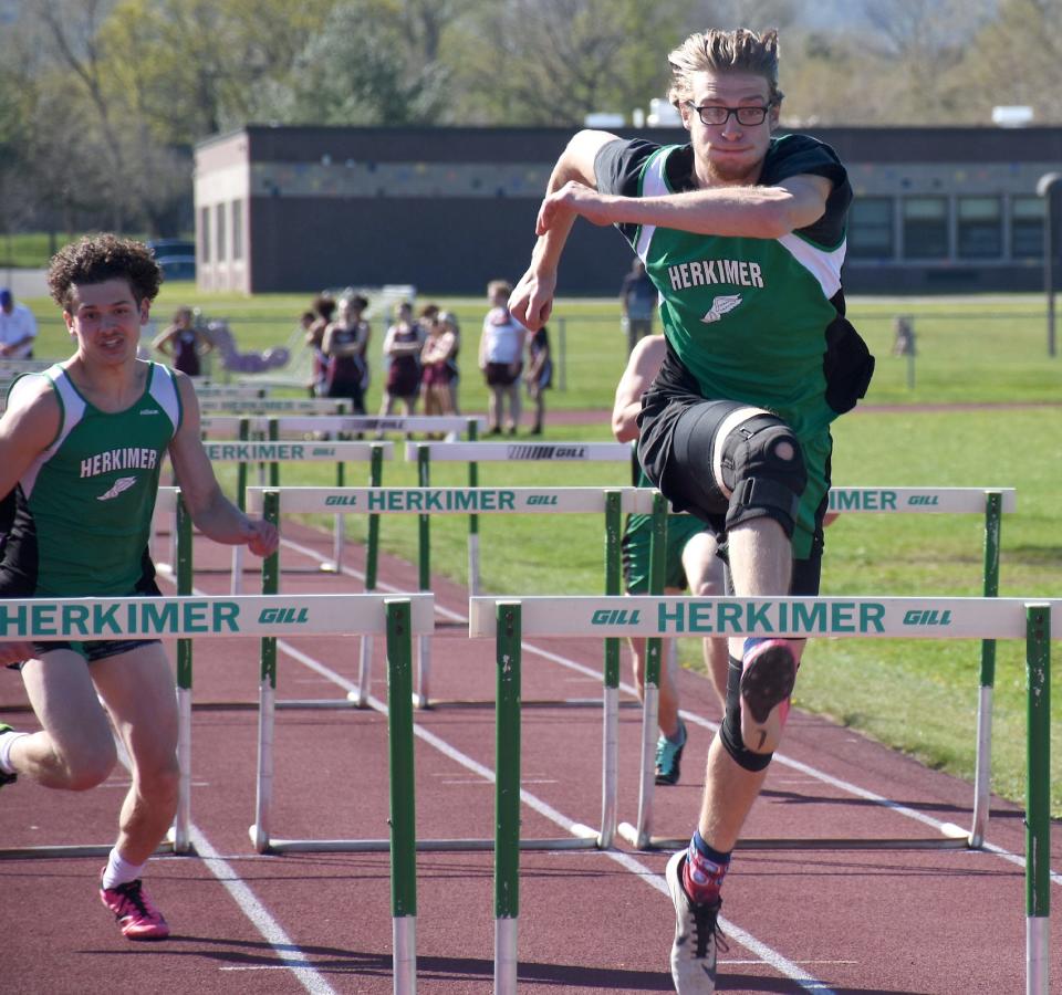 Herkimer Magician Brian Reile (right) steps into his final hurdle on the way to a win in Monday's 110-meter race.