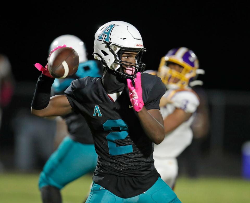 Atlantic QB Kwasie Kwaku looks to pass during a game with Lake Weir at Atlantic High School in Port Orange, Monday, Oct. 10, 2022.