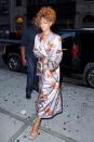 <p>Reinventing wedding attire by sporting a silk robe with a silver bag and heels to her stylist's nuptials in NYC</p>