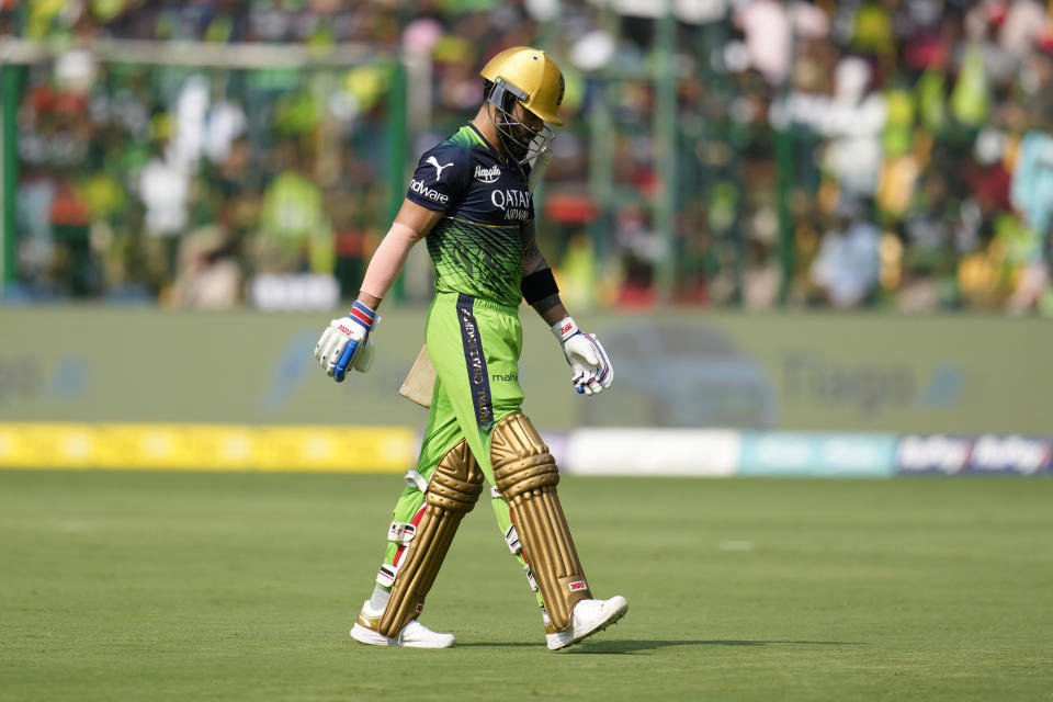 Royal Challengers Bangalore's Virat Kohli walks off the field after losing his wicket during the Indian Premier League cricket match between Royal Challengers Bangalore and Rajasthan Royals in Bengaluru, India, Sunday, April 23, 2023. (AP Photo/Aijaz Rahi)