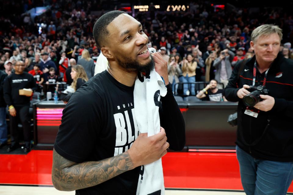 Portland Trail Blazers point guard Damian Lillard (0) reacts after the victory against the Houston Rockets at Moda Center.