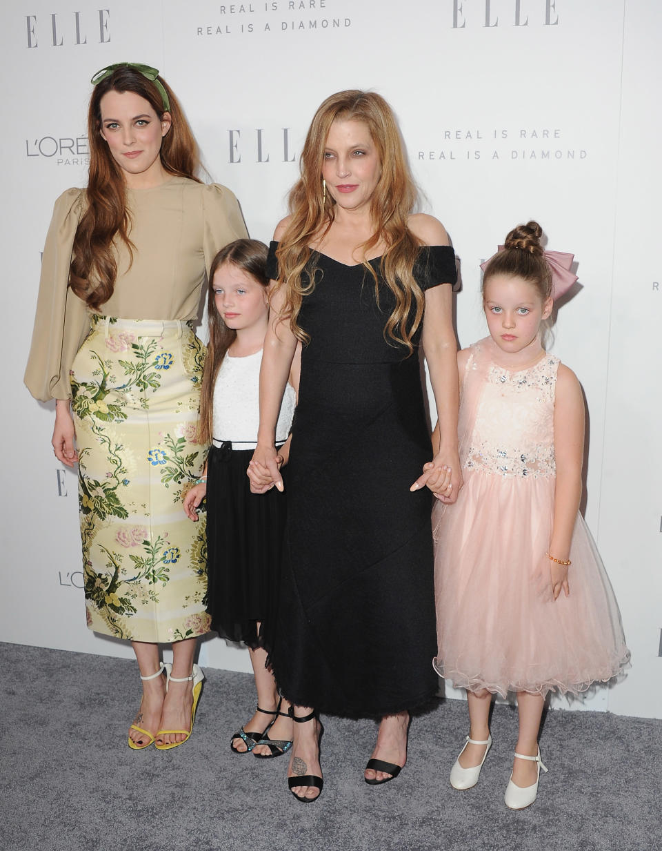 Lisa Marie Presley briefly lost custody of her her twin daughters, Finley and Harper, but she was with them as well as older daughter Riley Keough at an <em>Elle</em> event on Oct. 16, 2017. (Photo: Getty Images)