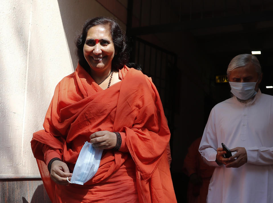 Hindu hardliner Sadhvi Ritambhara, an accused in the 1992 attack and demolition of a 16th century mosque, leaves for a court in Lucknow, India, Wednesday, Sept. 30, 2020. An Indian court on Wednesday acquitted all 32 accused, including four senior leaders of the ruling Hindu nationalist Bharatiya Janata Party, in the case. The demolition sparked Hindu-Muslim violence that left some 2,000 people dead. (AP Photo/Rajesh Kumar Singh)