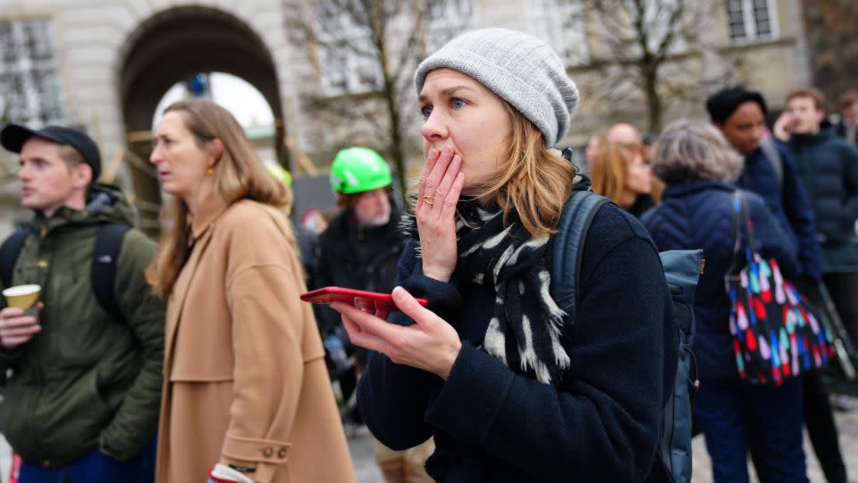 Shocked onlookers watch as the fire engulfs the historic building in central Copenhagen. - Ida Marie/Ritzau Scanpix/AFP/Getty Images