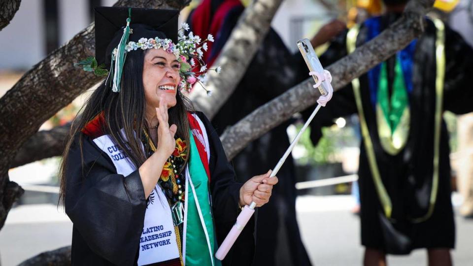 Maileen Mamaradlo thanks her family in the Philippines via video chat after getting her degree in psychology. She will attend Cal Poly. Cuesta College held the 57th commencement ceremony as a drive through.