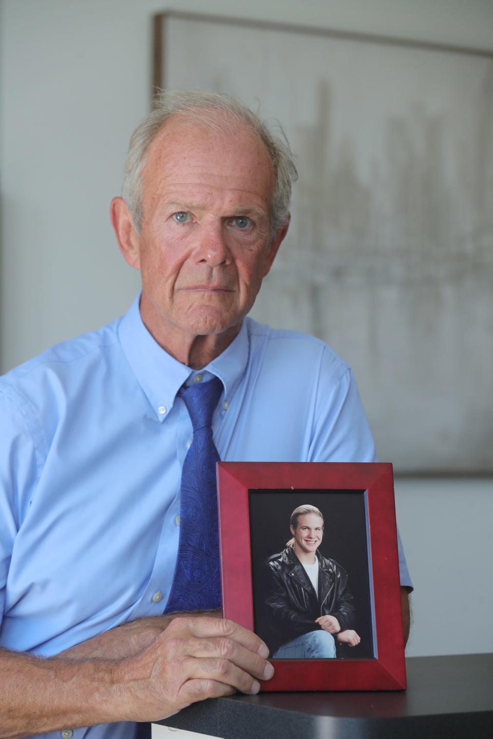 Jim Rauh with a photo of his son Thomas Rauh who died from a fentanyl overdose on Saturday, August 12, 2023 in Akron.