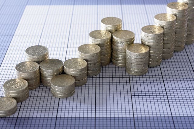 Stacks of pound coins forming ascending graph