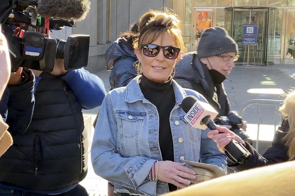 Former Alaska Gov. Sarah Palin leaves a courthouse in New York, Tuesday, Feb. 15, 2022. Palin lost her libel lawsuit against The New York Times on Tuesday when a jury rejected her claim that the newspaper maliciously damaged her reputation by erroneously linking her campaign rhetoric to a mass shooting. (AP Photo/David Martin)