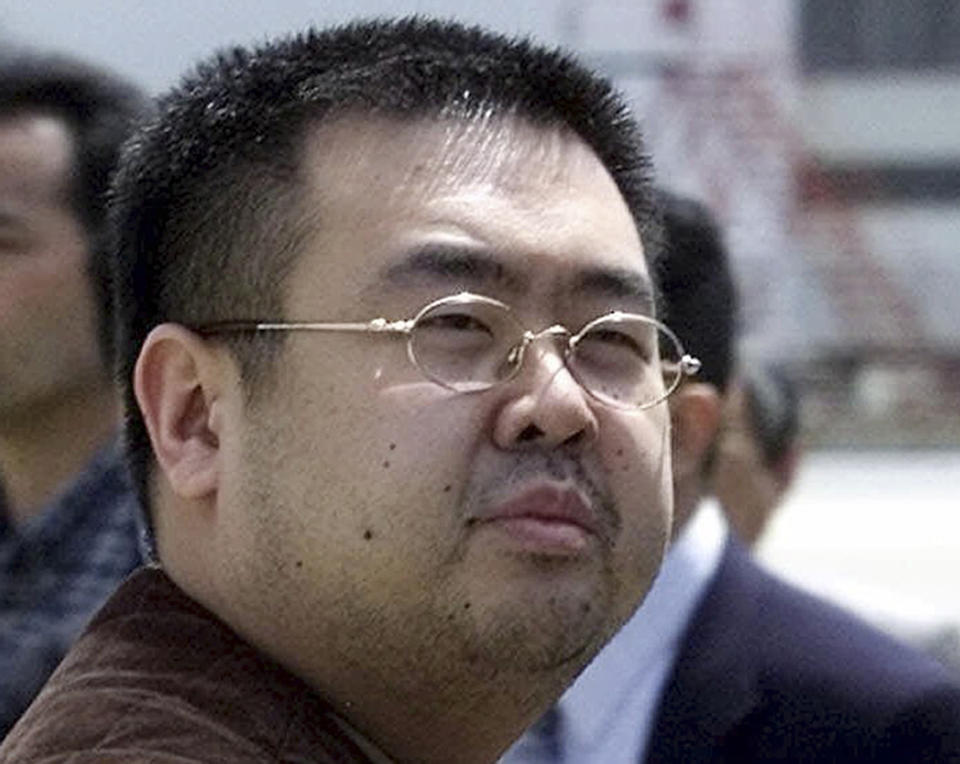 A file photo shows Kim Jong-nam, estranged half-brother of North Korea's leader Kim Jong-un, in Narita, Japan in 2001. A report from the Wall Street Journal cites a source claiming Kim Jong-man was an informant for the CIA.