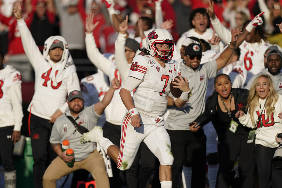 FILE - Utah quarterback Cameron Rising (7) runs for a touchdown during the first half in the Rose Bowl NCAA college football game against Ohio State Saturday, Jan. 1, 2022, in Pasadena, Calif. Rising isn’t facing a battle to be Utah’s starting quarterback heading into a new season. Rising cemented his spot atop the depth chart when he led the Utes to their first ever Pac-12 championship and Rose Bowl berth a season ago. (AP Photo/Mark J. Terrill, File)