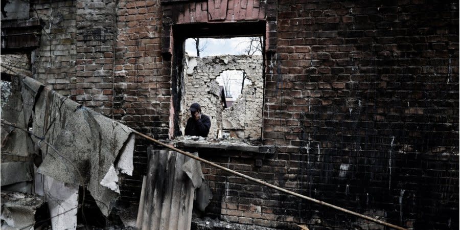 Oleksiy Sokolyuk looks over the ruins of his home, Irpin, Kyiv Oblast