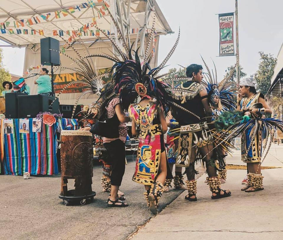 Dancers wearing traditional outfits prepare to take the stage in this archive photo from the 2019 LatinxFest in downtown Athens, Ga.