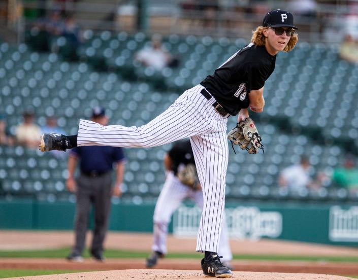 Ben Gregory attempts to get an out at first in the state championship baseball game between the Penn Kingsman and Cathedral Irish on Saturday, June 18, 2022 at Victory Field in Indianapolis. 