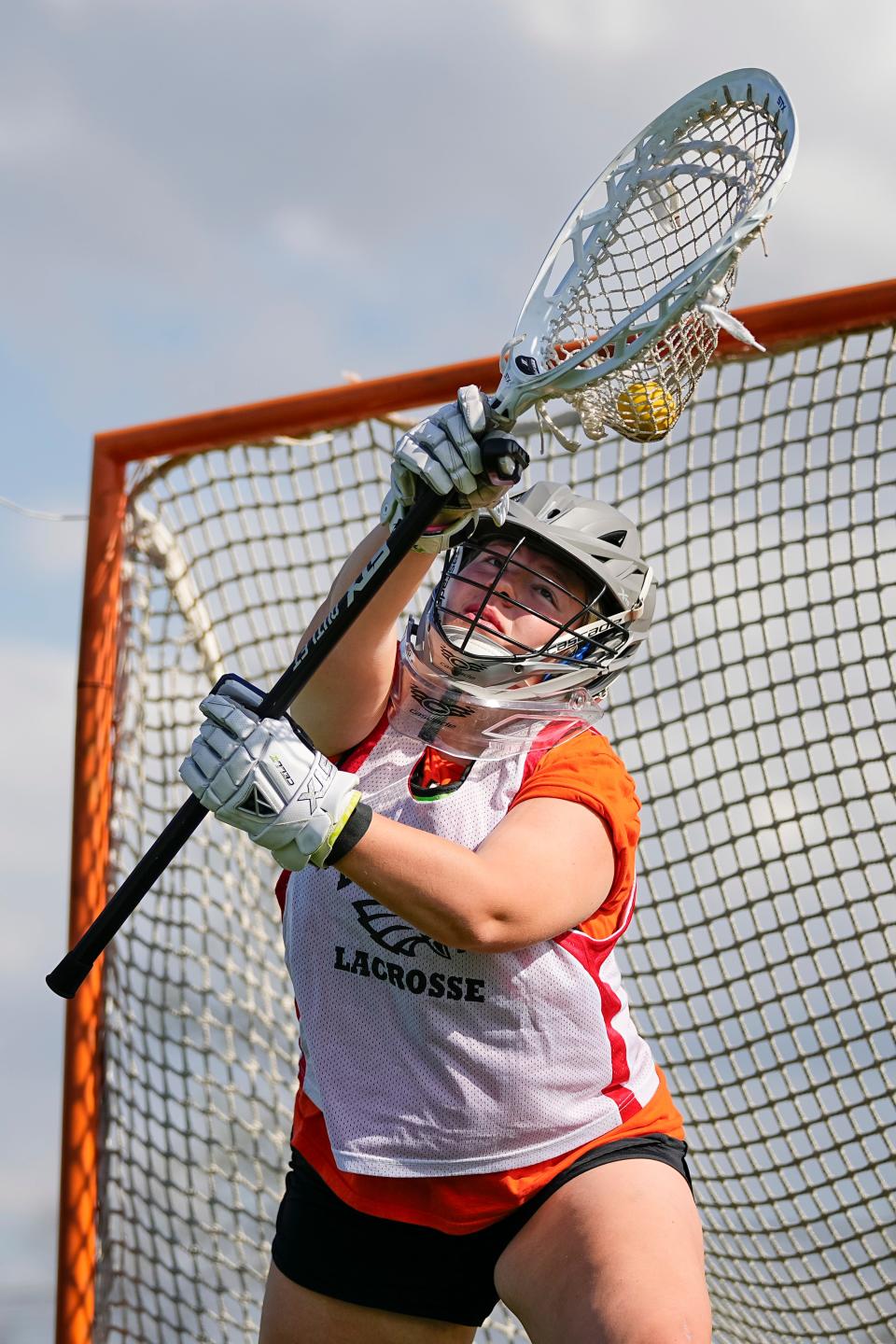 Big Walnut's Caroline Weber makes a save during a recent practice. She is the state’s all-time saves leader in girls lacrosse, according to Ohio High School Athletic Association records.