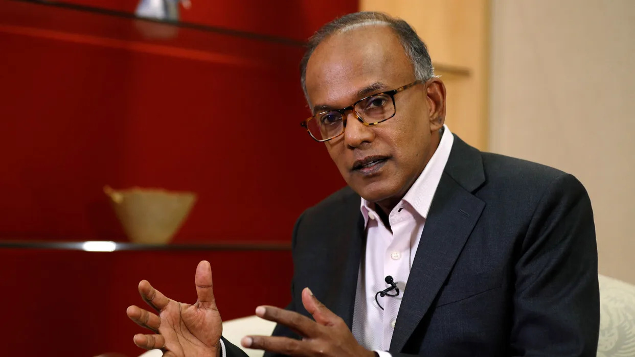 K. Shanmugam gestures while seated for an interview. (PHOTO: Reuters)