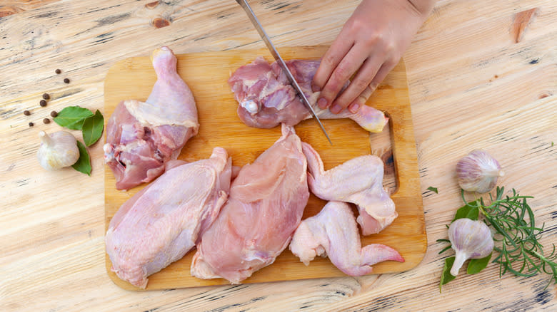 Cutting chicken thighs