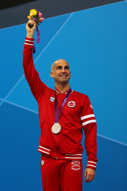 LONDON, ENGLAND - SEPTEMBER 05: Silver medallist Benoit Huot of Canada poses on the podium during the medal ceremony for the Men's 400m Freestyle - S10 Final  on day 7 of the London 2012 Paralympic Games at Aquatics Centre on September 5, 2012 in London, England.  (Photo by Mike Ehrmann/Getty Images)