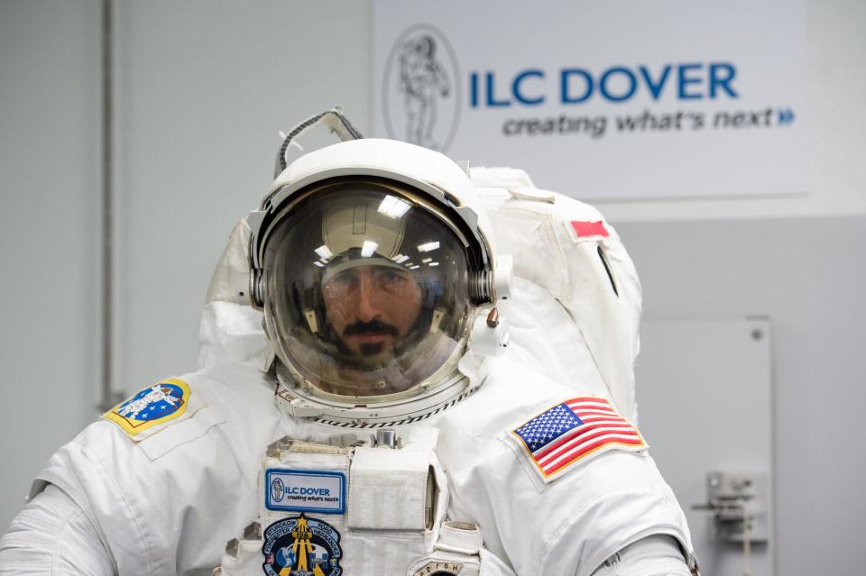 Jim Connolly performs a test on a astronaut space suit at ILC Dover in Frederica.
