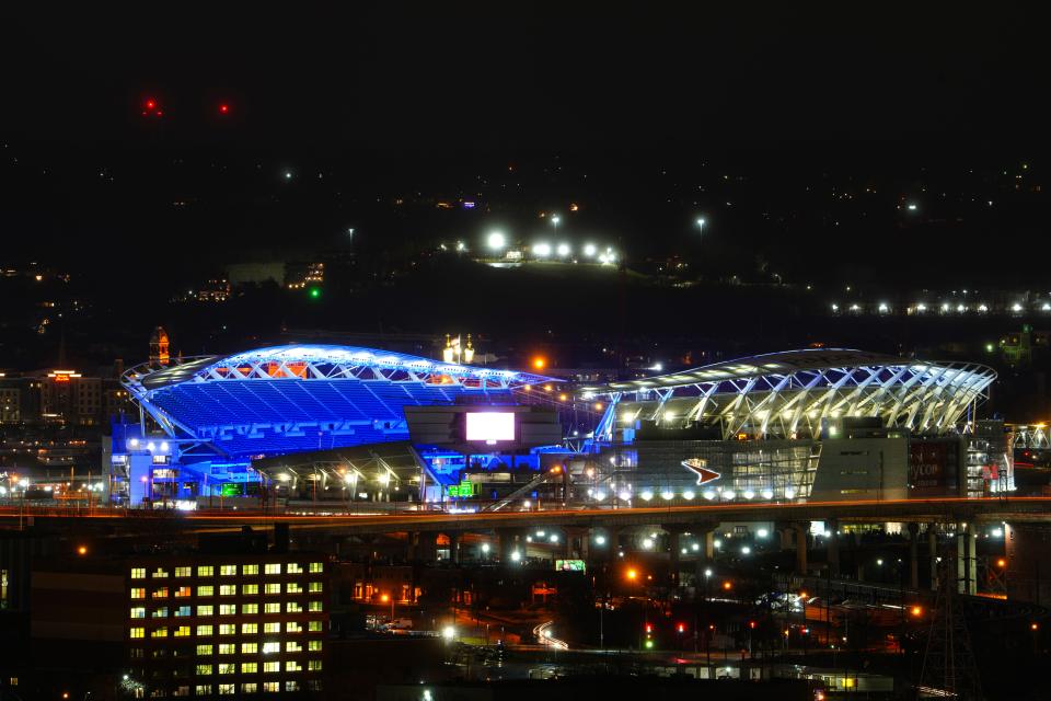 Paycor Stadium lit blue and red in recognition of Buffalo Bills safety Damar Hamlin.